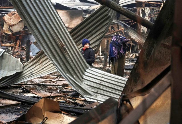 A boy looks at the damaged central market, hit by a Russian military overnight strike, amid Russia's attack on Ukraine, in the frontline city of Kramatorsk, Ukraine, on November 30, 2025. (Photo by Anatolii Stepanov/Reuters)