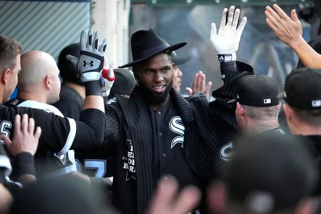 Chicago White Sox's Luis Robert Jr. is congratulated by teammates in the dugout after hitting a two-run home run during the first inning of a baseball game against the Los Angeles Angels Wednesday, June 28, 2023, in Anaheim, Calif. (Photo by Mark J. Terrill/AP Photo)