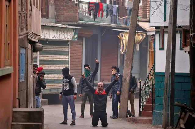 Masked protesters shout pro-freedom slogans during an anti-India protest in Srinagar, November 25, 2016. (Photo by Danish Ismail/Reuters)