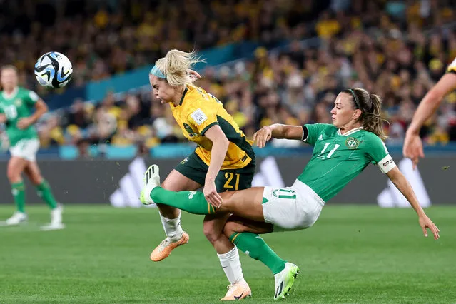Ireland's midfielder Katie McCabe (R) and Australia's defender #21 Ellie Carpenter fight for the ball during the Australia and New Zealand 2023 Women's World Cup Group B football match between Australia and Ireland at Stadium Australia, also known as Olympic Stadium, in Sydney on July 20, 2023. (Photo by David Gray/AFP Photo)