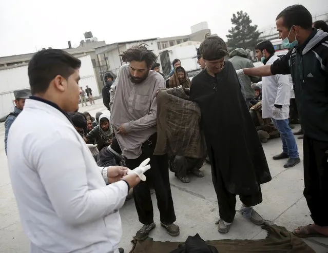 Health workers help to undress people at a newly-opened treatment centre at Camp Phoenix, after a police round up of suspected drug addicts in Kabul, Afghanistan December 27, 2015. (Photo by Ahmad Masood/Reuters)