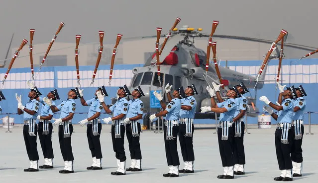 An Indian Air Force soldiers' Drill Team presents their skills as they perform during the Indian Air Force Day celebrations at the Air Force base Hindon on the outskirts of New Delhi, India, 08 October 2018. The Indian Air Force celebrates its 86th anniversary. (Photo by Rajat Gupta/EPA/EFE)