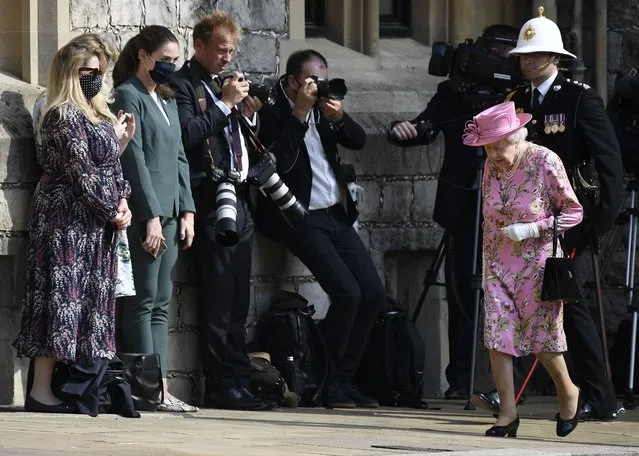 Britain's Queen Elizabeth II arrives to meet with US President Joe Biden before receiving a Guard of Honour at Windsor Castle near London, Sunday, June 13, 2021. (Photo by Alberto Pezzali/AP Photo)