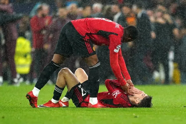Manchester United's Alejandro Garnacho (right) is consoled by team-mate Anthony Martial after the final whistle in the UEFA Champions League Group A match at Old Trafford, Manchester on Tuesday, October 3, 2023. (Photo by Martin Rickett/PA Wire)