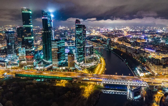 This aerial view taken with a drone on November 5, 2017 shows the Moscow City business district and the Moskva River. (Photo by Dmitry Serebryakov/AFP Photo)