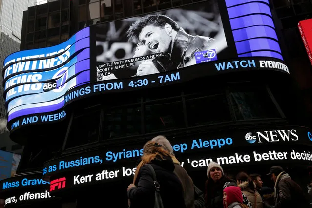 A screen in Times Square features the image of late singer George Michael in Manhattan, New York City, U.S., December 26, 2016. (Photo by Andrew Kelly/Reuters)
