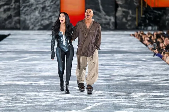 American singer Cher and French fashion designer Olivier Rousteing walk the runway during the Balmain Womenswear Spring/Summer 2023 show as part of the Balmain Festival V03 during the Paris Fashion Week on September 28, 2022 in Paris, France. (Photo by Stephane Cardinale – Corbis/Corbis via Getty Images)