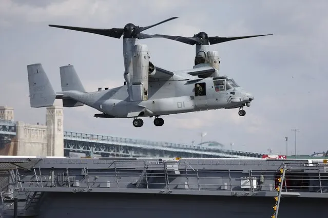 A Marines Osprey lands aboard the USS Somerset, February 27, 2014, in Philadelphia.  A congressional oversight committee has launched an investigation into the V-22 Osprey program following the latest deadly crash,  which killed eight Air Force special operations service members. The entire Osprey fleet remains grounded following the crash, with the exception of some limited Marine Corps flights. (Photo by Matt Rourke/AP Photo)