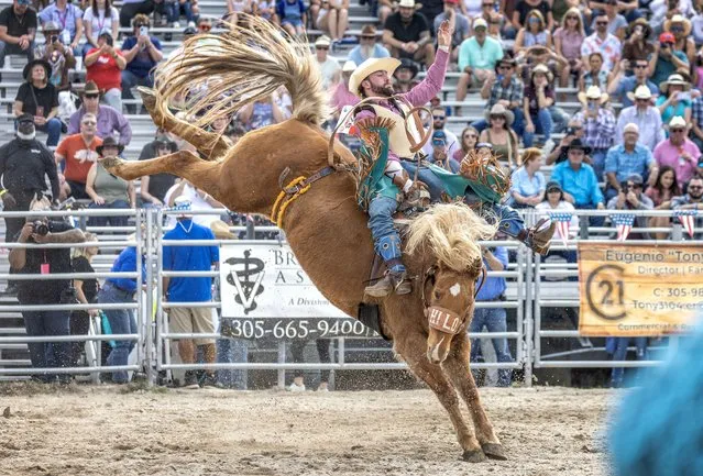 A cowboy participates in the 75th Homestead Rodeo Championship at the Homestead Rodeo field in Homestead, Florida, USA, 27 January 2024. The Homestead Rodeo Championship is one of the longest lasting traditional rodeos and the southernmost rodeo in the United States. The Homestead Rodeo is one of the first rodeos in the circuit of the Professional Rodeo Cowboys Association and it draws cowboys from around the country who want to start accumulating points toward the December national finals. (Photo by Cristobal Herrera-Ulashkevich/EPA)