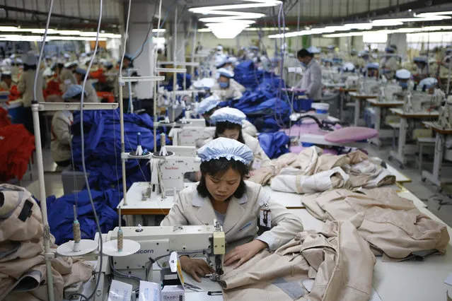 North Korean employees work in a factory of a South Korean company at the Joint Industrial Park in Kaesong industrial zone, a few miles inside North Korea from the heavily fortified border December 19, 2013. (Photo by Kim Hong-Ji/Reuters)