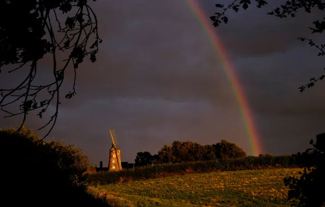 A rainbow forms over a windmill after rainfall in Shepshed, Britain, August 5, 2016. (Photo by Darren Staples/Reuters)