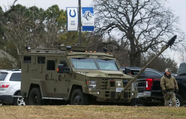 An armored law enforcement vehicle is seen in the area where a man has reportedly taken people hostage at a synagogue during services that were being streamed live, in Colleyville, Texas, U.S. January 15, 2022. (Photo by Shelby Tauber/Reuters)