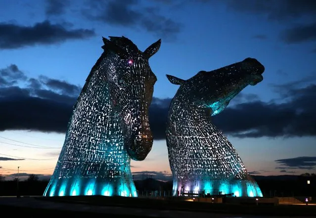 A lighting test is carried out on the Kelpies in Falkirk ahead of their  official opening to the public later this month, on April 7, 2014. Designed by sculptor Andy Scott each of The Kelpies stands up to 30 metres tall and each one weighs over 300 tonnes. (Photo by Andrew Milligan/PA Wire)