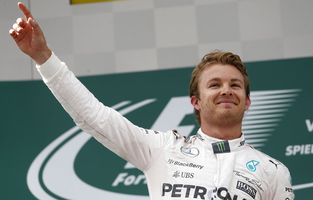 Mercedes driver Nico Rosberg of Germany celebrates his victory in the Formula One Grand Prix race, at the Red Bull Ring in Spielberg, southern Austria, Sunday, June 21, 2015. (AP Photo/Darko Bandic)