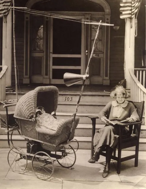 Invention to keep a baby content in its pram so that mother can read untroubled: the pram is provided with a radio, including antenna and loudspeaker. Instead of a baby, two dolls have been put in the pram to illustrate the goal of this invention. Date: 1921. (Photo by Mary Evans Picture Library/Caters News)