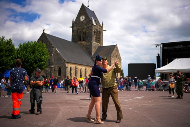 Reenactors dance at Sainte-Mere-Eglise town square, Normandy, France, Wednesday, June 5, 2024. World War II veterans from across the United States as well as Britain and Canada are in Normandy this week to mark 80 years since the D-Day landings that helped lead to Hitler's defeat. (Photo by Daniel Cole/AP Photo)