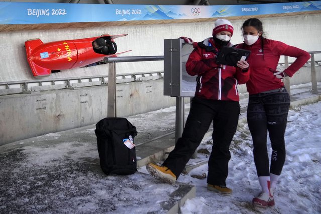 Mingming Huai of China speeds down the track during a 2-woman bobsled training at the 2022 Winter Olympics, Tuesday, Feb. 15, 2022, in the Yanqing district of Beijing. (Photo by Mark Schiefelbein/AP Photo)