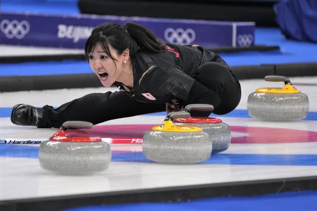 Japan's Chinami Yoshida shouts instructions to teammates during a women's curling semifinal match between Japan and Switzerland at the Beijing Winter Olympics Friday, February 18, 2022, in Beijing. (Photo by Nariman El-Mofty/AP Photo)