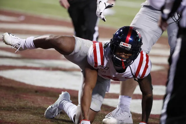 Mississippi wide receiver Elijah Moore (8) reacts following a touchdown by his team against Mississippi State during the second half of an NCAA college football game in Starkville, Miss., Thursday, November 28, 2019. The act resulted in a 15-yard penalty assessed on the extra point that was missed. (Photo by Rogelio V. Solis/AP Photo)