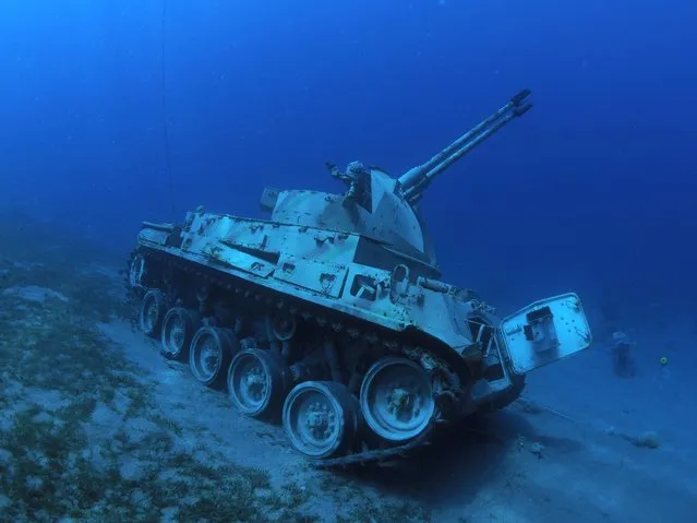 This handout picture released by Jordan's Aqaba Special Economic Zone Authority (ASEZA) on July 23, 2019 shows a Jordanian Armed Forces armored vehicle lies on the seabed of the Red Sea off the coast of the southern port city of Aqaba, part of a new underwater military museum. (Photo by Aqaba Special Economic Zone Authority via Reuters)