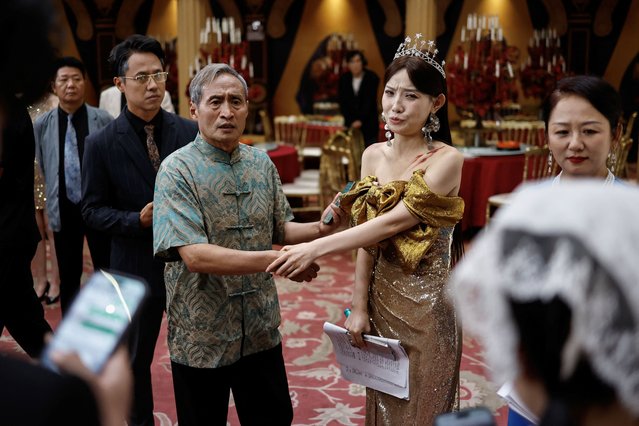 Actor Zhu Jian, 69, rehearses with other actors on the set of a micro movie during a filming session at a banquet hall, in Zhengzhou, Henan province, China on July 16, 2024. (Photo by Tingshu Wang/Reuters)