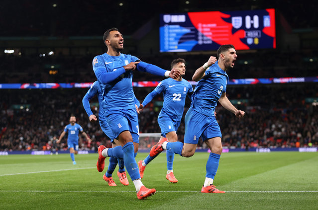 Vangelis Pavlidis of Greece celebrates scoring his team's first goal as he gestures towards his black armband in honour of the passing of former Greek football player George Baldock during the UEFA Nations League 2024/25 League B Group B2 match between England and Greece at Wembley Stadium on October 10, 2024 in London, England. (Photo by Julian Finney/Getty Images)