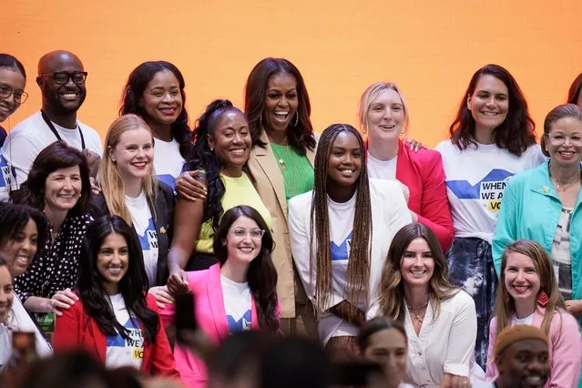 Former first lady Michelle Obama, center, takes pictures with When We All Vote staff members after her speech at the Culture of Democracy Summit in Los Angeles, Monday, June 13, 2022. (Photo by Jae C. Hong/AP Photo)