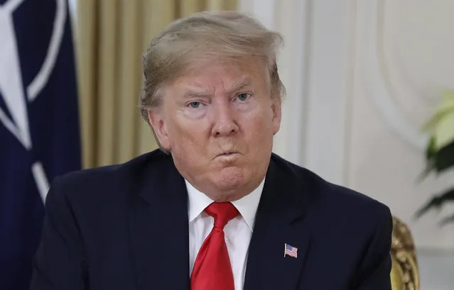 U.S. President Donald Trump grimaces during a meeting with NATO Secretary General, Jens Stoltenberg at Winfield House in London, Tuesday, December 3, 2019. US President Donald Trump will join other NATO heads of state at Buckingham Palace in London on Tuesday to mark the NATO Alliance's 70th birthday. (Photo by Evan Vucci/AP Photo)