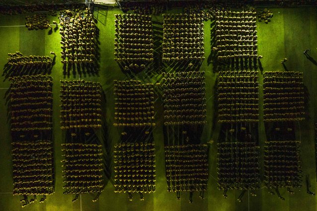 Handout picture released by El Salvador's Presidency Press Office showing an aerial view of soldiers standing guard before taking part in an operation to arrest gang members in San Marcos, El Salvador, in the early hours of October 28, 2024. Around 2,500 soldiers and police surrounded a shantytown on the outskirts of San Salvador to arrest gang members, the country's president, Nayib Bukele, announced on Monday. (Photo by El Salvador's Presidency Press Office/Handout via AFP Photo)