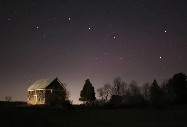 In this November 11, 2010 photo, the big dipper shines in the evening sky over a 212-year-old farm house in Brunswick, Maine. (Photo by Robert F. Bukaty/AP Photo)