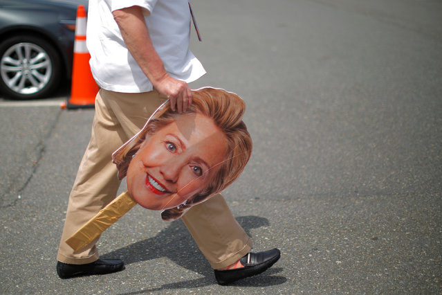 A man carries a cardboard cutout of the face of U.S. Democratic presidential candidate Hillary Clinton outside the Democratic National Convention in Philadelphia, Pennsylvania, U.S. July 26, 2016. (Photo by Brian Snyder/Reuters)