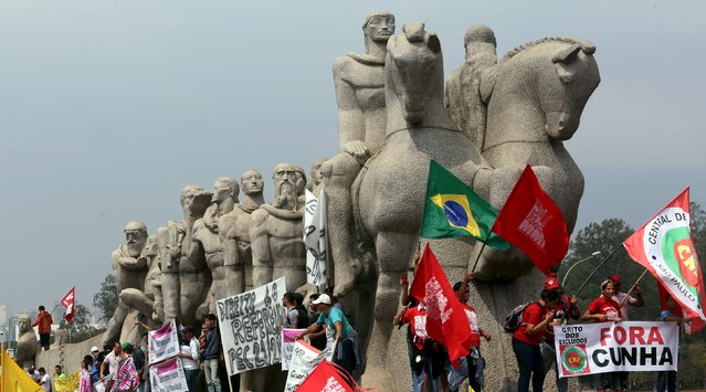 People from social movements attend a demonstration in support of human rights and democracy during Brazil's Independence Day in Sao Paulo, Brazil September 7, 2015. (Photo by Paulo Whitaker/Reuters)