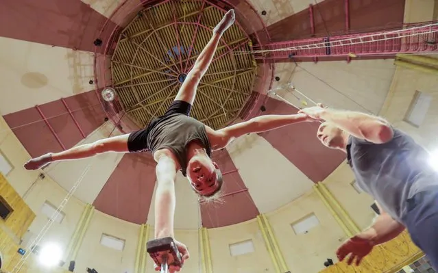 A student during a class at the Rumyantsev State School of Circus and Variety Arts in Moscow, Russia on November 21, 2019. The school, named after Russian clown Mikhail Rumyantsev aka Karandash, trains acrobats, gymnasts, jugglers, equilibrists, clowns, etc. (Photo by Vyacheslav Prokofyev/TASS)