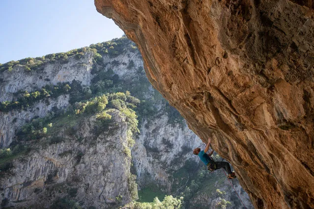 A man climbs on the rocks of Emin Aga valley in Epirus region, Ioannina, Greece, 09 May 2020. (Photo by Dimitris Tosidis/EPA/EFE)