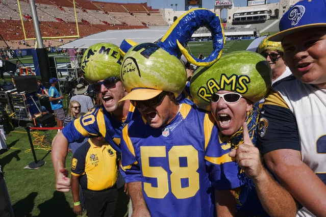 Los Angeles Rams fans cheer as they arrive at Los Angeles Memorial Coliseum on Saturday, August 13, 2016. Los Angeles fans celebrate the return of the NFL and their long-lost Rams to the city at the team's first preseason NFL game against the Dallas Cowboys. (Photo by Richard Vogel/AP Photo)