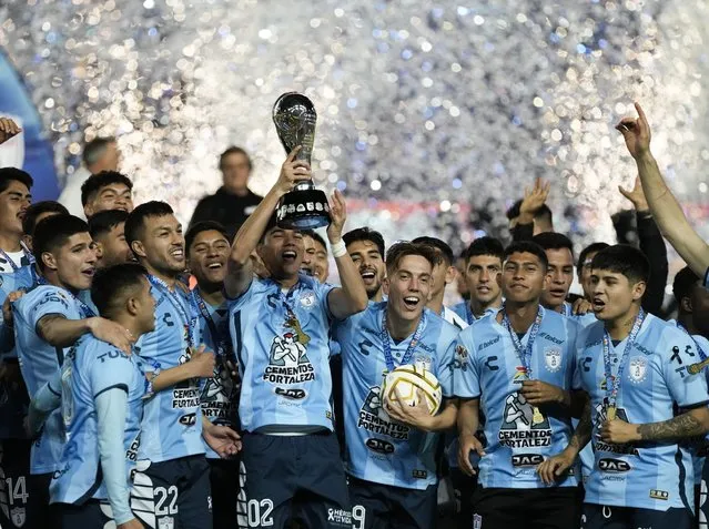 Pachuca players celebrate their victory over Toluca in the Mexican soccer league title match, in Pachuca, Mexico, Sunday, October 30, 2022. (Photo by Moises Castillo/AP Photo)