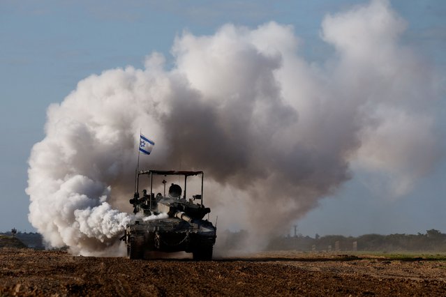 An Israeli tank manoeuvres near the Israel-Gaza border, amid the ongoing conflict between Israel and the Palestinian Islamist group Hamas, in Israel, on January 24, 2024. (Photo by Amir Cohen/Reuters)