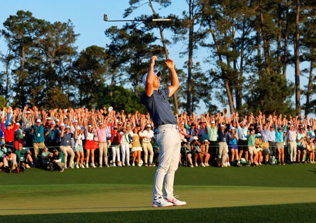 Northern Ireland’s Rory McIlroy celebrates on the 18th green after winning the Masters in Augusta, Georgia, US on April 13, 2025. McIlroy’s defeat of Justin Rose on the first sudden-death hole means he has become just the sixth player in history to win the career grand slam. (Photo by Brian Snyder/Reuters)