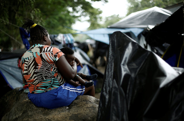 An African migrant stranded in Costa Rica sits with her child at a makeshift camp at the border between Costa Rica and Nicaragua, in Penas Blancas, Costa Rica, September 7, 2016. (Photo by Juan Carlos Ulate/Reuters)