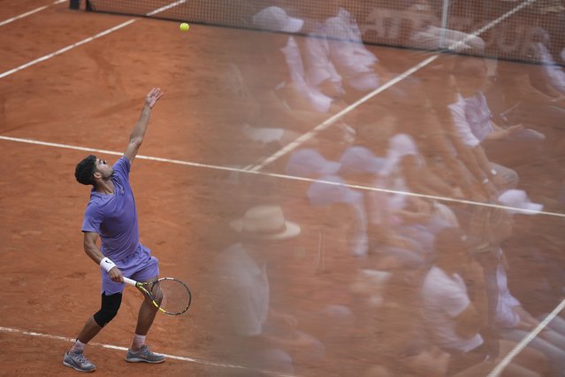 Spain's Carlos Alcaraz serves during a round of sixteen match against Russia's Karen Khachanov at the Italian Open tennis tournament in Rome, Tuesday, May 13, 2025. (Photo by Andrew Medichini/AP Photo)