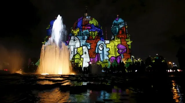 People look at a light installation at the Berlin Cathedral during the opening day of the "Festival of Light" show in Berlin, Germany, October 9, 2015. (Photo by Hannibal Hanschke/Reuters)