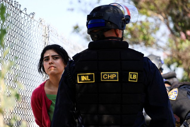 A demonstrator reacts to being detained near the Edward R. Roybal Federal Building during a protest against federal immigration sweeps in downtown Los Angeles, California, on June 10, 2025. (Photo by David Swanson/Reuters)