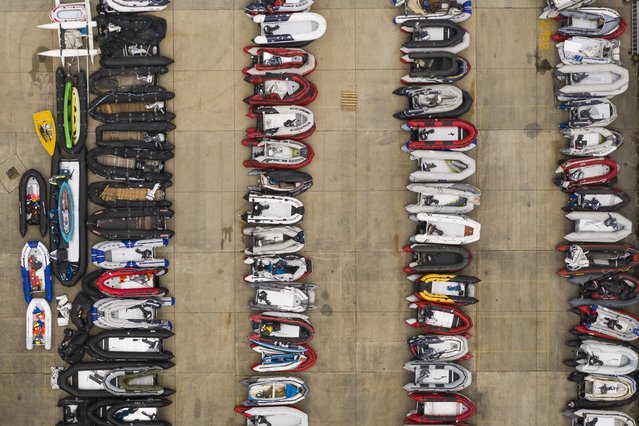 A storage yard for the dinghies, ribs and rowing boats previously used by migrants to cross the English Channel from France is seen on August 12, 2020 in Dover, England. In recent weeks, large numbers of migrants have travelled in small boats across the English channel, looking to claim asylum in the UK. (Photo by Dan Kitwood/Getty Images)