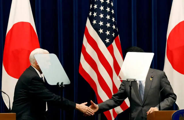 U.S. Vice President Mike Pence (L) and Japan's Prime Minister Shinzo Abe shake hands during their joint announcement after their meeting at Abe's official residence in Tokyo, Japan, February 7, 2018. (Photo by Toru Hanai/Reuters)