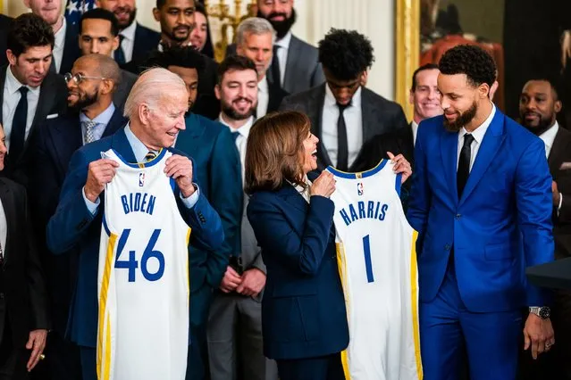 Golden State Warriors basketball player Stephen Curry presents US President Joe Biden and Vice President Kamala Harris with jerseys during an event to celebrate the 2022 NBA Champions the Golden State Warriors in the East Room of the White House on January 17, 2023. (Photo by Demetrius Freeman/The Washington Post)