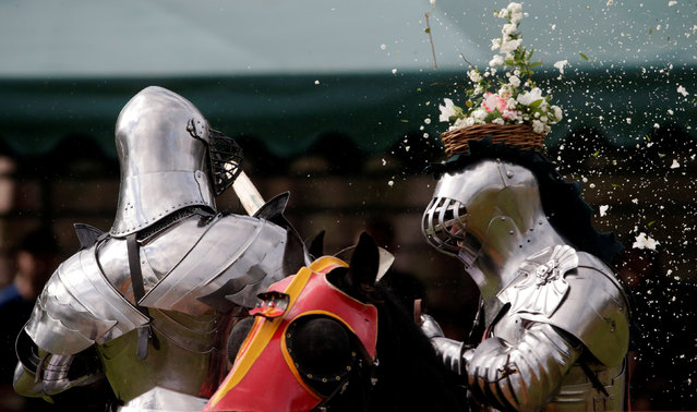 Australian knight Philip Leitch (R) has a floral basket on his helmet smashed by an opponent at the St Ives Medieval Fair in Sydney, one of the largest of its kind in Australia, September 25, 2016. (Photo by Jason Reed/Reuters)