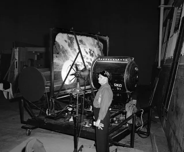 Hollywood can't go to the ocean, because of wartime restrictions, so the ocean comes to Hollywood, through this machine which creates waves and clouds in the studio, for sea pictures in Hollywood on August 24, 1943. Electrically operated, the machine, which resembles a bread-mixer, projects clouds and sea in motion on a backdrop in such a way that the camera picks up the image, and a stationary ship on a stage seems to be pitching in waves. So realistic is the effect that cast and crew often complain of seasickness. The device was created by technical “The Ghost Ship”, and won the Academy Award for outstanding technical development. (Photo by AP Photo)