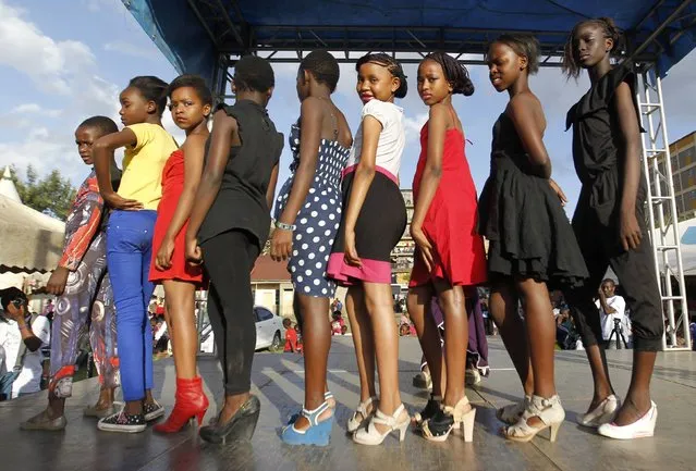Models are seen during the Miss Koch beauty pageant, titled “Getting to Zero Teenage Pregnancy”, at the Korogocho slums in Nairobi, December 6, 2014. (Photo by Thomas Mukoya/Reuters)