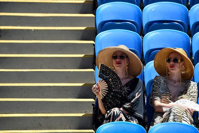 Spectators attend day three of the Australian Open tennis tournament in Melbourne on January 19, 2022. (Photo by Paul Crock/AFP Photo)