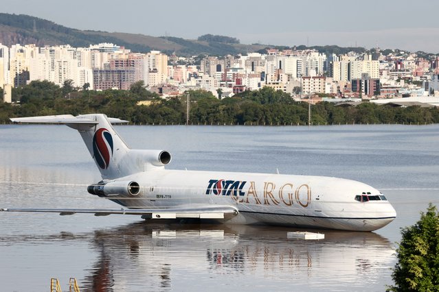 A cargo plane sits on a flooded runway at the airport in Porto Alegre, Rio Grande do Sul, Brazil, on May 6, 2024. (Photo by Diego Vara/Reuters)